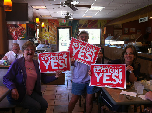 People holding signs in support of the Keystone pipeline
