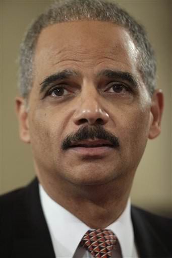 Attorney General Eric Holder says the federal government will enforce its 