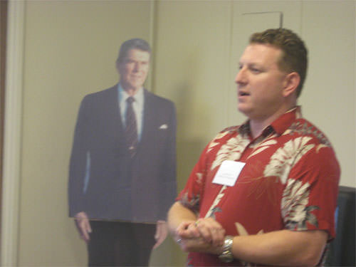 A crudely doctored photograph shows the "ghost" of Ronald Reagen haunting Republican John Stammreich. 