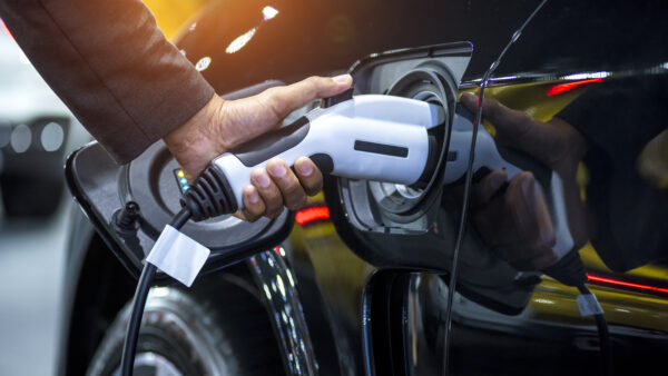 Driver charges an electric car
