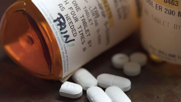 Bottle of pain pills tipped over.