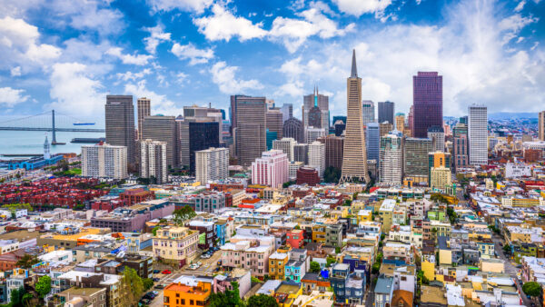 Skyline of San Francisco with bright blue and cloudy sky