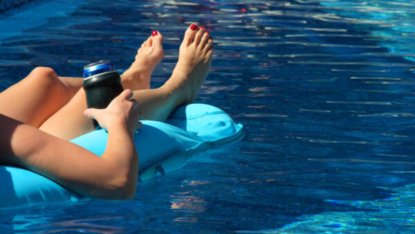 Swimming pool beer can summer fun sporting equipment tariffs free trade Biden Trump