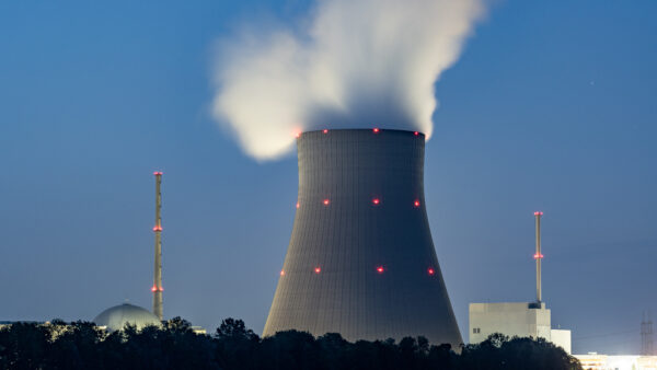 Steam rolling off of a nuclear reactor in low light