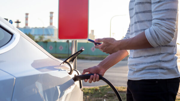 Man charges an electric car