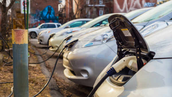 Electric cars charging at recharging station.