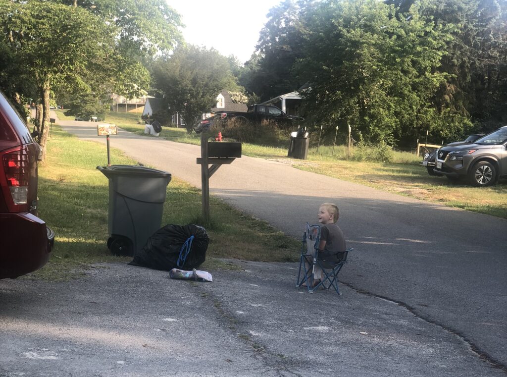 Emily Fields son waiting for the garbage truck