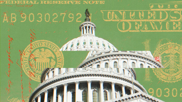 The U.S. Capitol is seen with money in the background