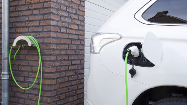 An electric car charging at home.