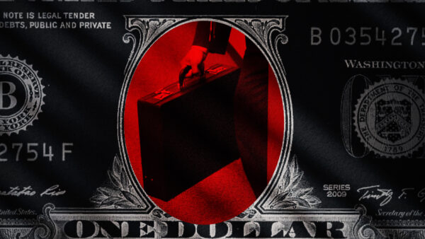 A shadowy figure clutches a briefcase in the center of a note of U.S. currency.