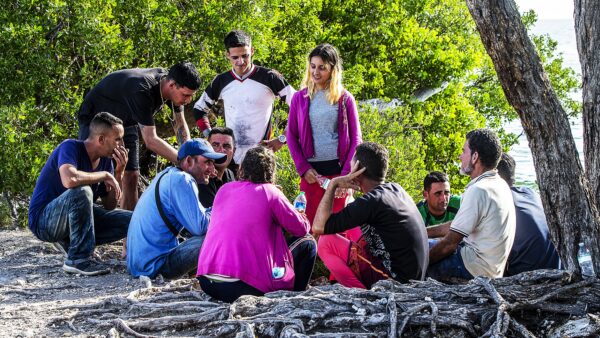A group of Cuban migrants stand in the sun after arriving in the Florida Keys on January 2.