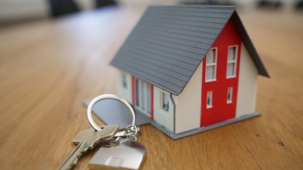 model house next to key