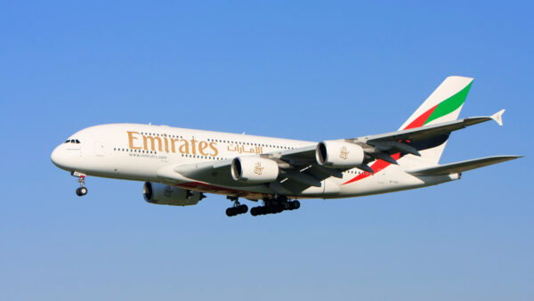 Emirates airplane flying in the sky