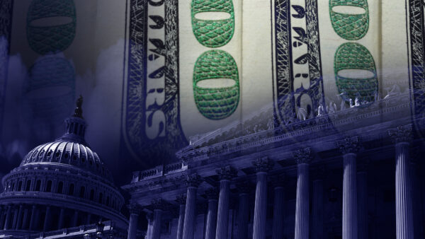The U.S. Capitol is seen next to $100 bills