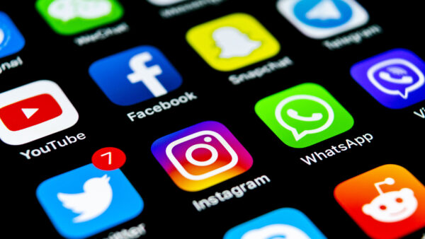 A smartphone screen depicting social media apps YouTube, Facebook, Snapchat, Telegram, Twitter (now X), Instagram, Whatsapp, Skype, Reddit, etc.