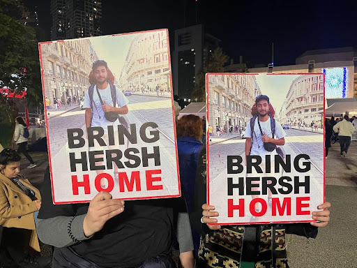 Protesters in Israel hold up posters of a young hostage that reads, "Bring Hersh Home" | Photo: Nancy Rommelmann