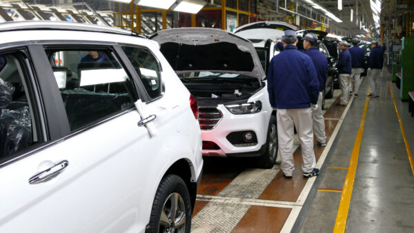 Workers on an automotive assembly line in Tianjin, China.