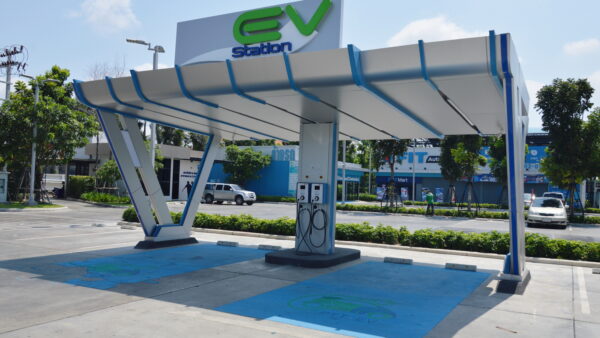 A public electric vehicle charging station labeled "E.V. Station"