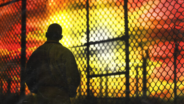 Prisoner with sun in background