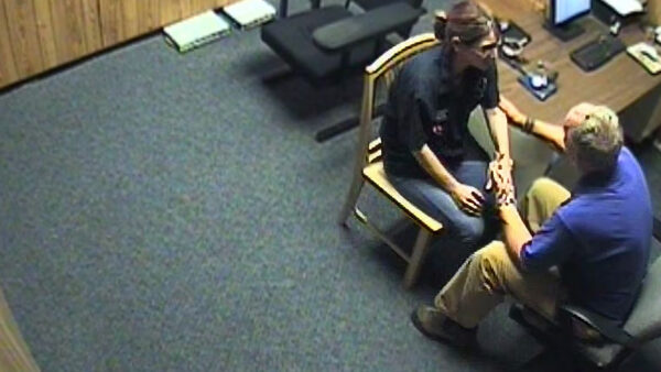 A screenshot from police interrogation room footage