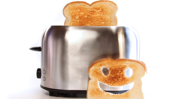 Toaster with toast and a smiley face