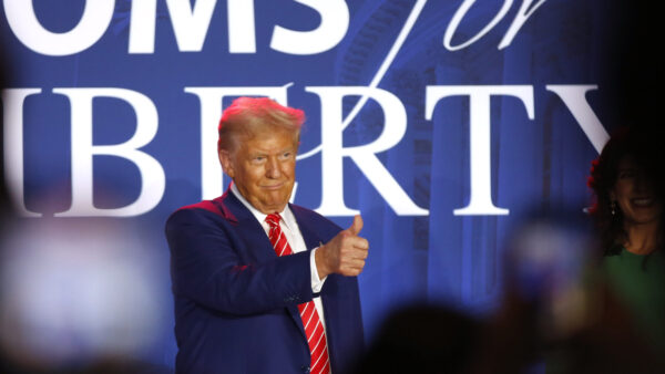 Trump giving a thumbs up at a Moms for Liberty event