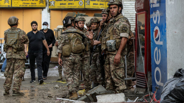 Lebanese army soldiers secure the site where a building was hit by an Israeli airstrike in the southern suburbs of Beirut, Lebanon. 24 September 2024.