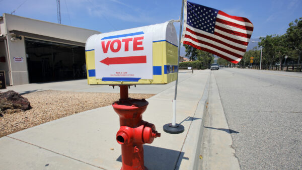 A mailbox with a VOTE sign and arrow.