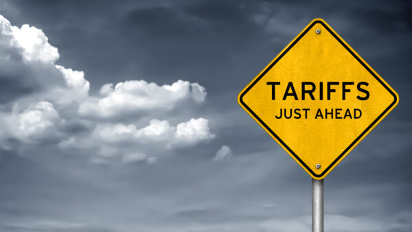 Storm clouds with a "Tariffs Just Ahead" sign