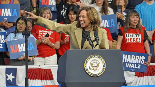 Vice President Kamala Harris points at someone out of frame, during a campaign rally in Phoenix.