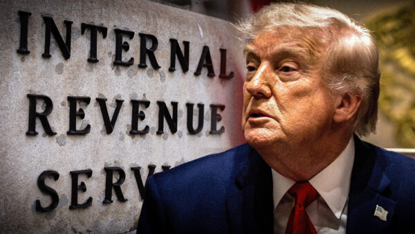 President Donald Trump against a backdrop of an IRS sign